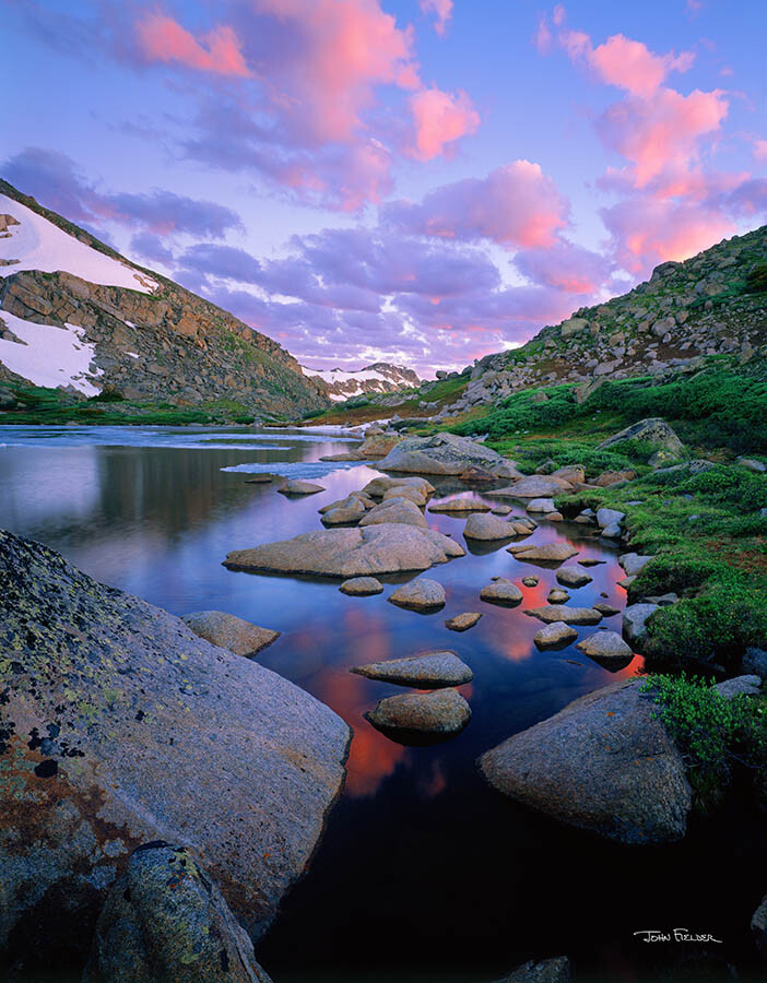 large format photo of a river with many large stones