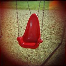 Red Swing on playground