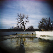 Empty pool in the spring with melted snow runoff
